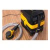 Vacuum and sander on a wood floor
