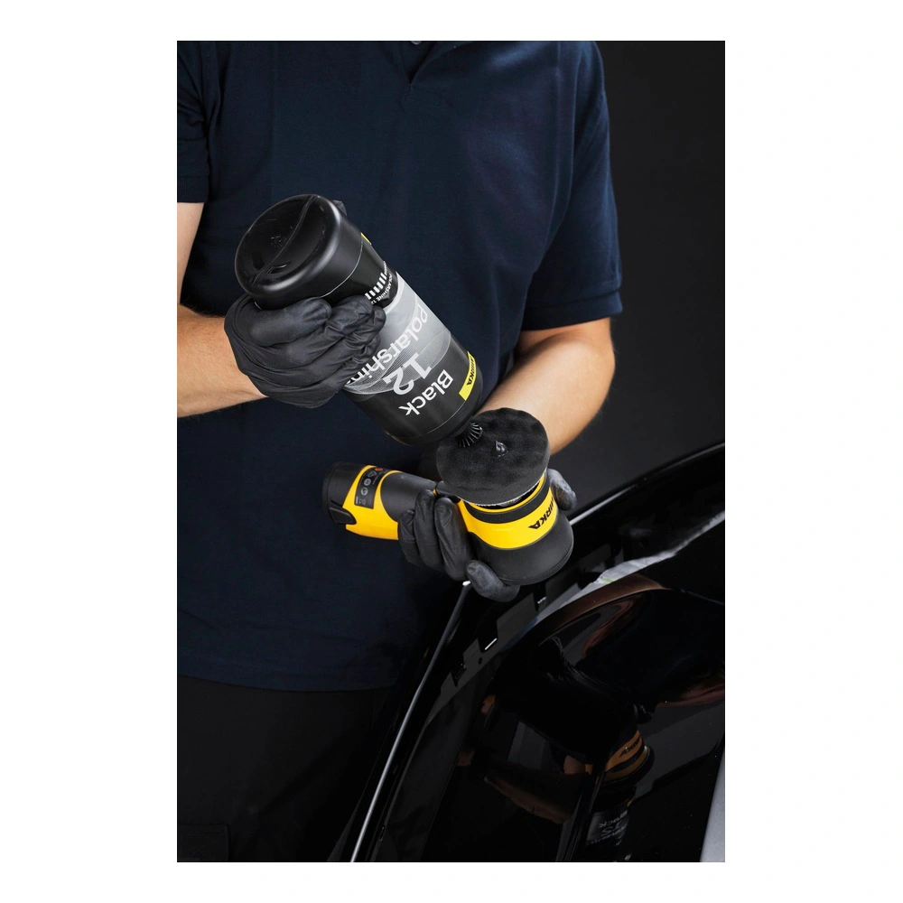 Person applying polish to a polishing machine