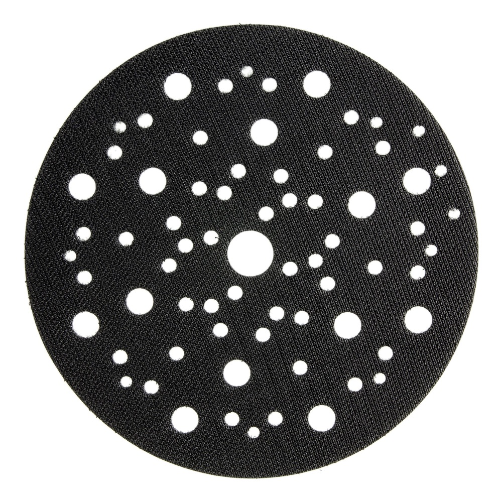 Black round pad with many white holes