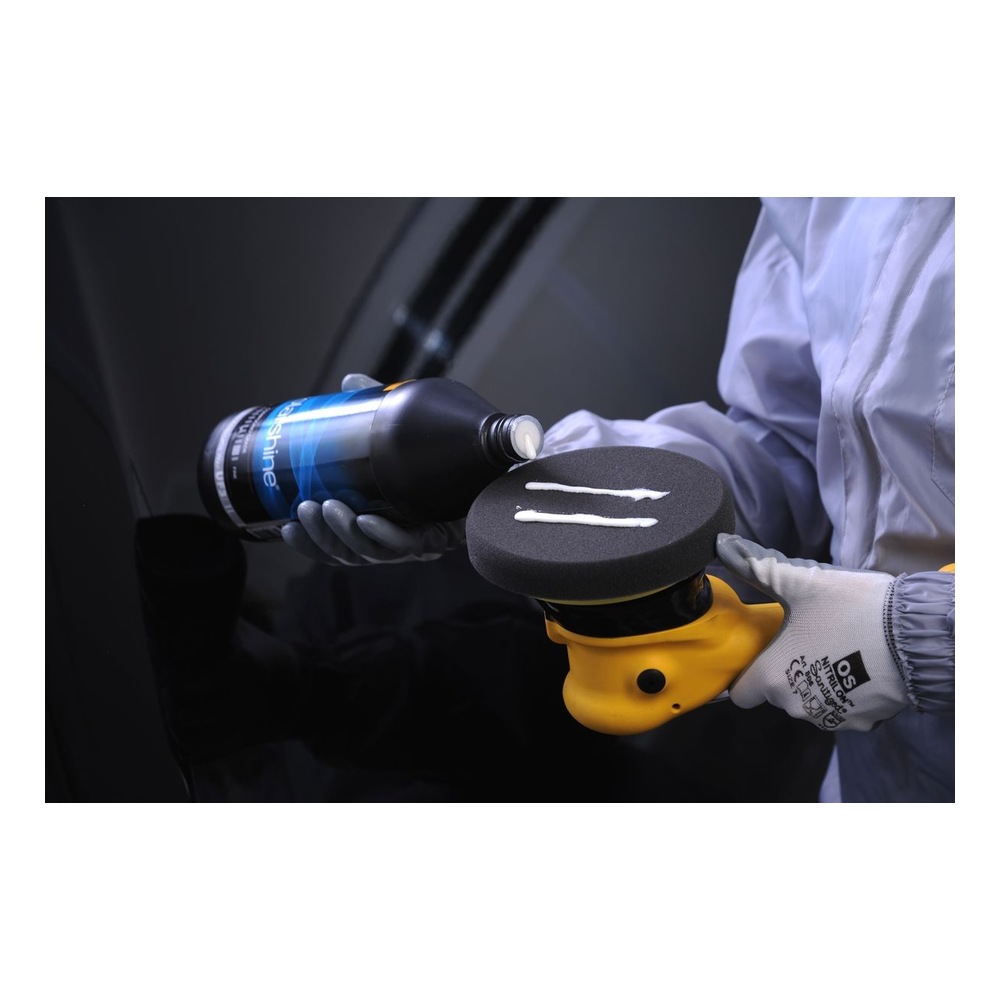 Person applying compound to a polishing pad