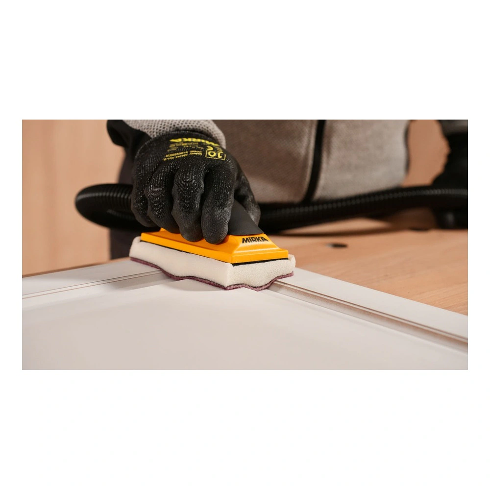 Hand sander with foam pad on table