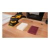 Sander, foam pad and fiber pad on table