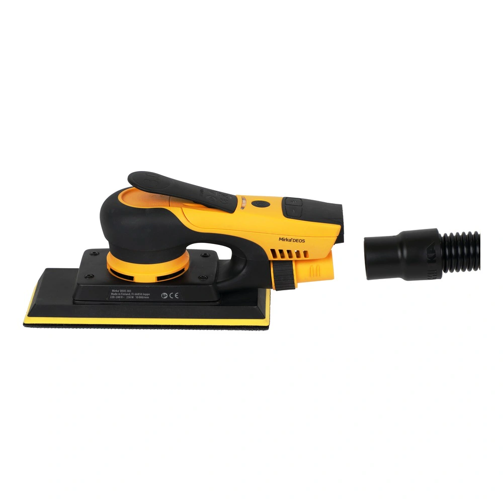 Yellow and black hand sander with connector nearby