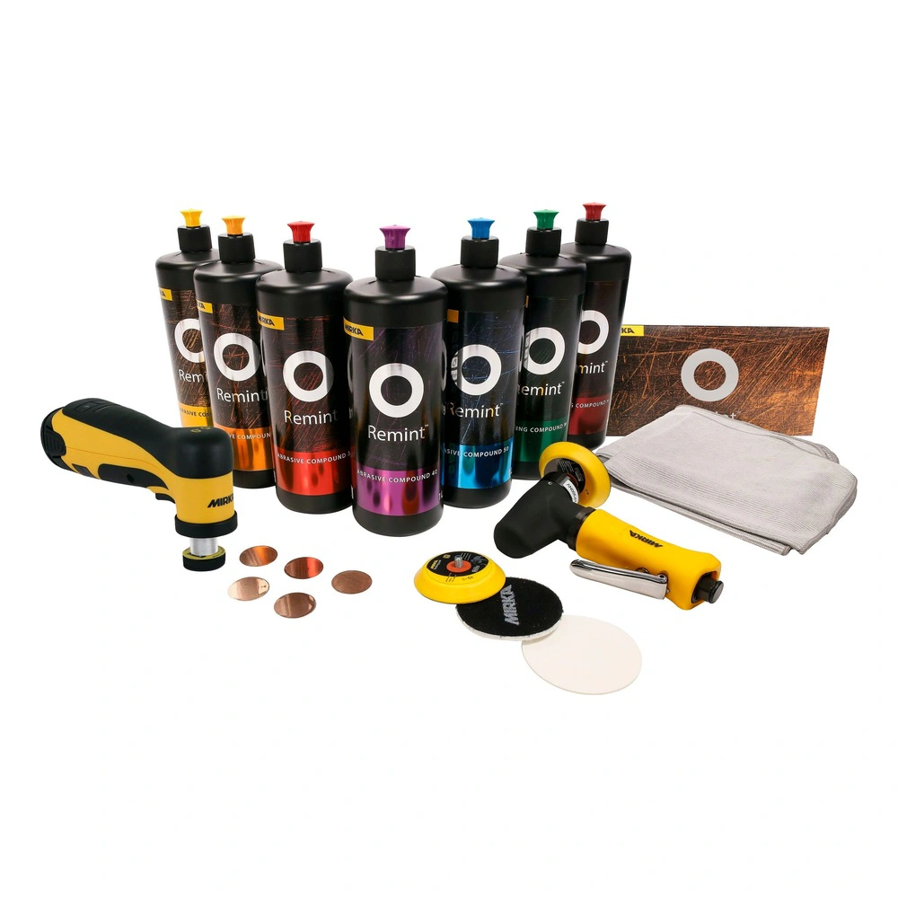 Seven black bottles and polishing accessories on white