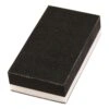 Close-up of black-white rectangular block with textured face