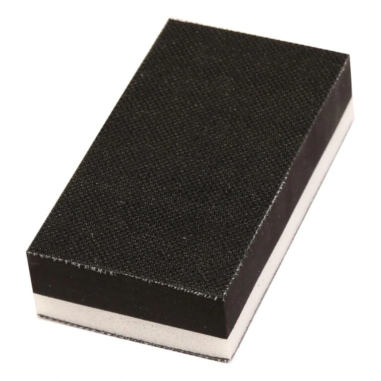 Close-up of black-white rectangular block with textured face