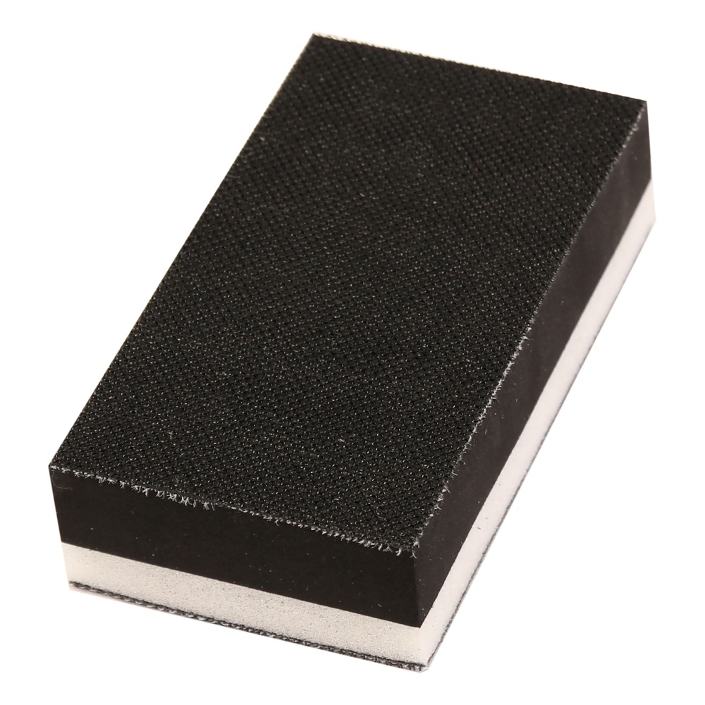 Close-up of black-white rectangular block with textured face