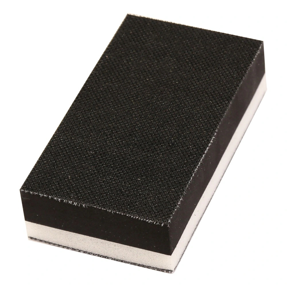 Close-up of black-white rectangular block with textured face