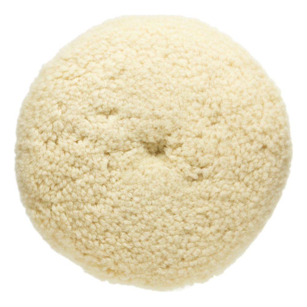 Round cream-colored wool pad