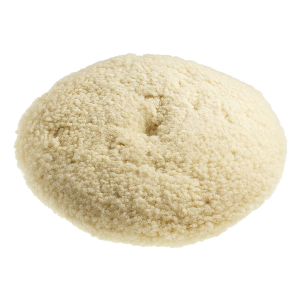 Round cream-colored wool pad