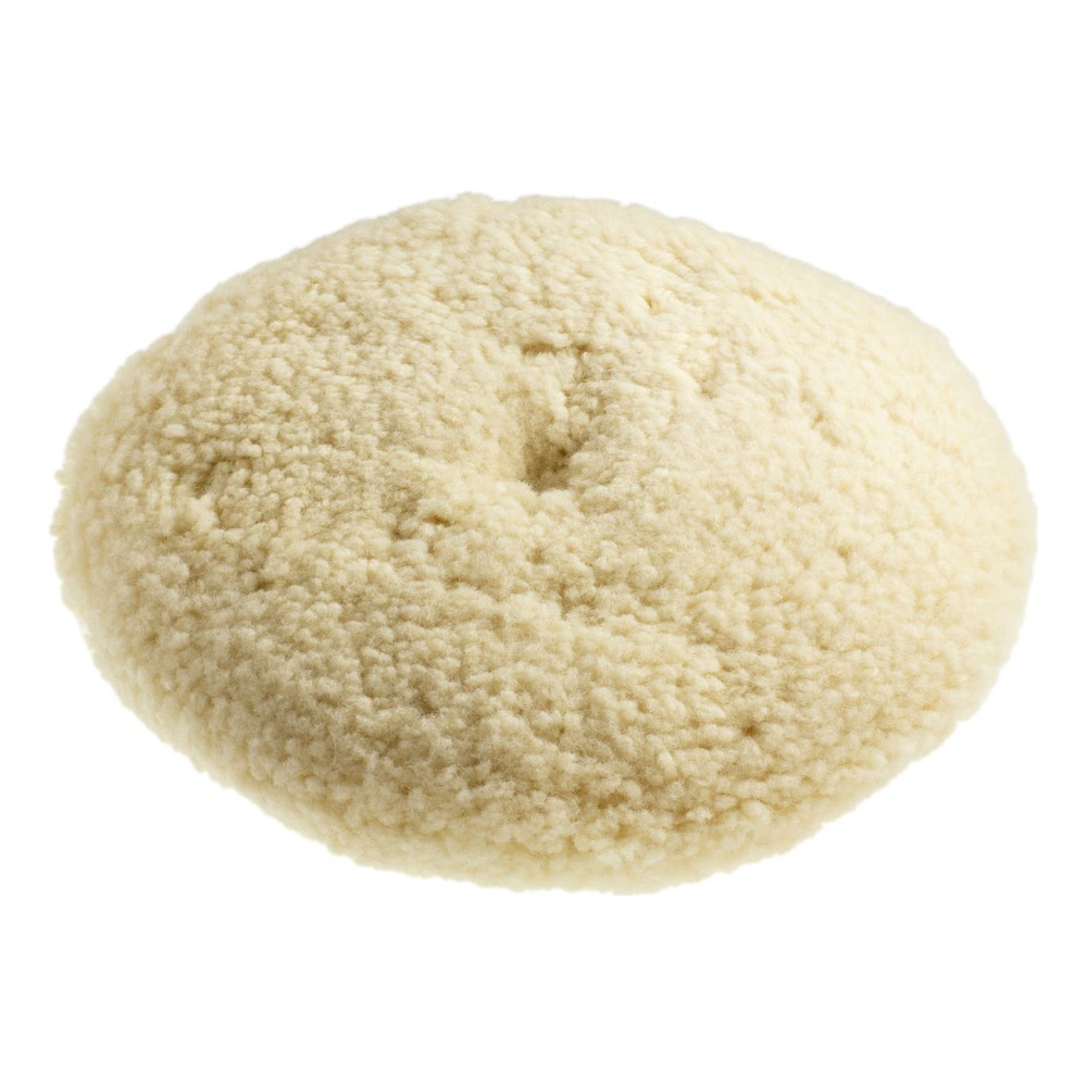 Round cream-colored wool pad