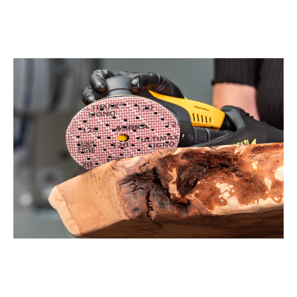 Person using a sander on a wood piece