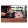 Person sanding a wood board with perforated disc
