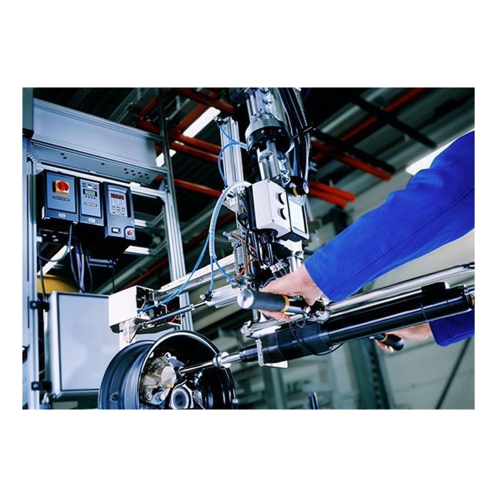 Straight nutrunner operating beside an industrial assembly