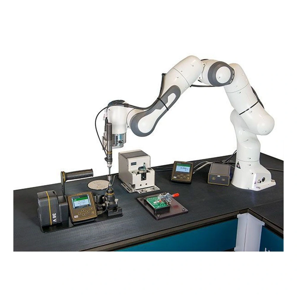 Robotic arm mounts a screwdriver on a workbench