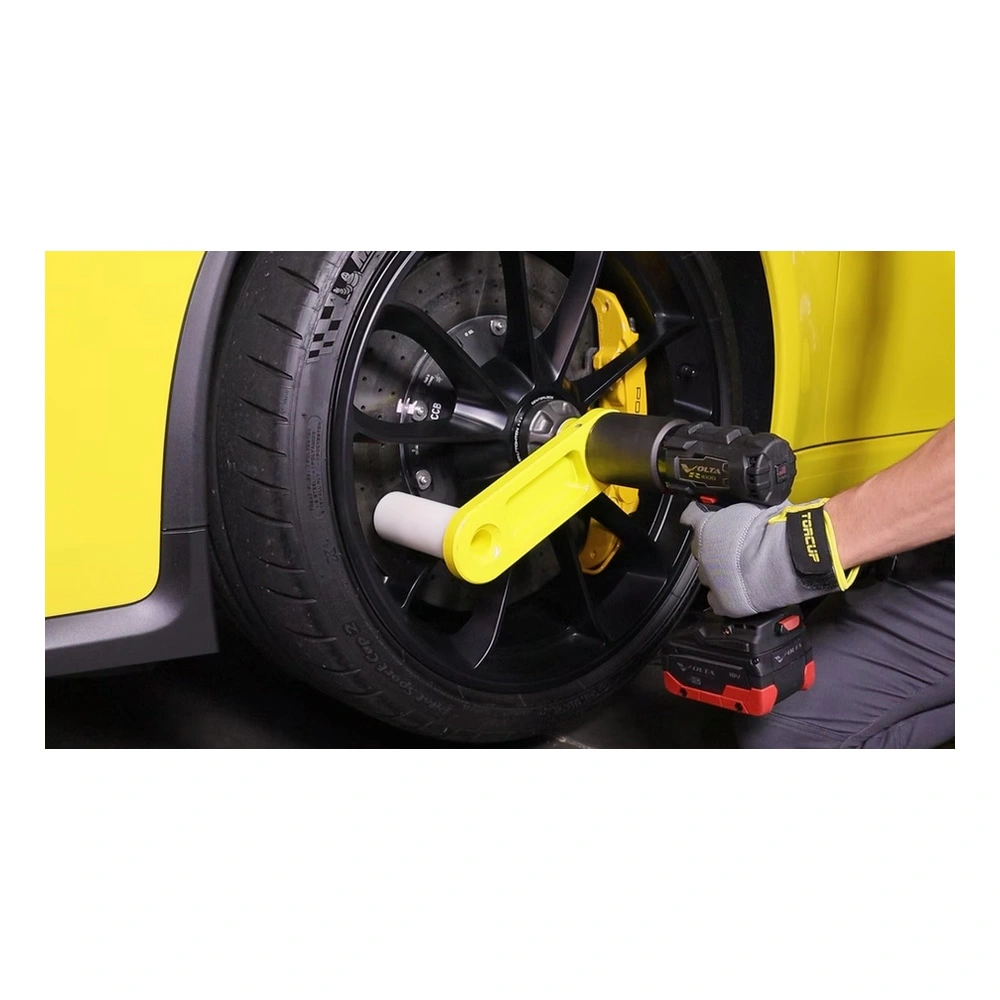 Torque wrench on black car wheel
